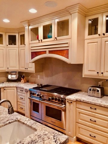 Custom kitchen cabinets with glass uppers by Oakridge Cabinet and Design